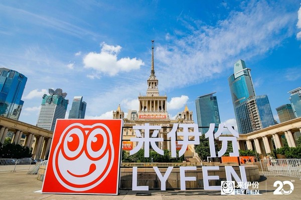 A sign in front of a buildingDescription automatically generated