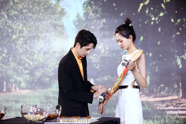 A picture containing person, outdoor, person, holdingDescription automatically generated